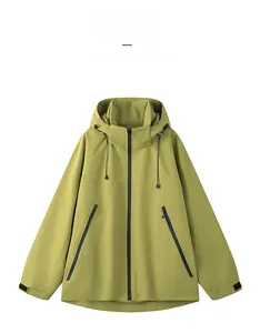 Detail view of mustard green waterproof jacket featuring adjustable drawstring hood and cuffs