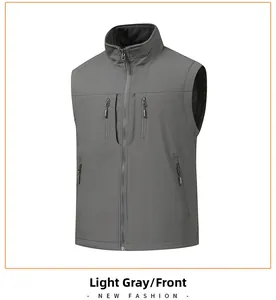 Detail of light grey vest featuring waterproof fabric and multiple functional zippers