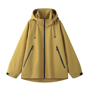 Detail of yellow waterproof outdoor jacket featuring hood drawstrings and adjustable cuffs