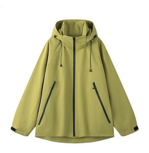 Detail view of mustard yellow outdoor jacket with zipper pockets and adjustable hood