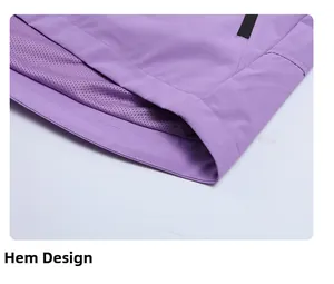 Detail of purple jacket hem with breathable mesh lining and a secure zipper pocket