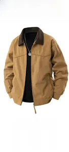 Detail of khaki work jacket featuring dark brown corduroy collar and zipper closure