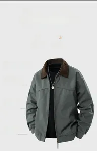 Close-up of casual jacket showing dark green fabric and brown corduroy collar detail