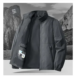 Detail of dark grey jacket featuring breathable mesh lining and secure internal zipper pocket