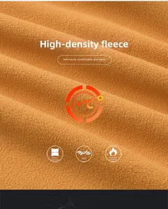 Close-up of high-density orange polar fleece fabric showing soft and warm texture