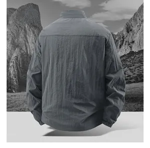 Back view of a grey waterproof men jacket with a minimalist stand collar and textured fabric