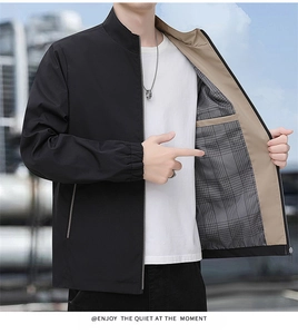 Detail of men's black stand collar jacket featuring gray checkered lining and metal zipper