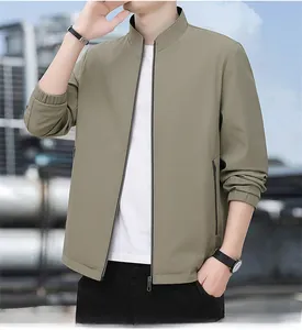 Detail view of khaki business casual jacket featuring a stand collar and elastic cuffs