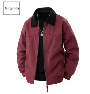 Close-up of berry red zip-up jacket featuring a black collar and elastic cuffs