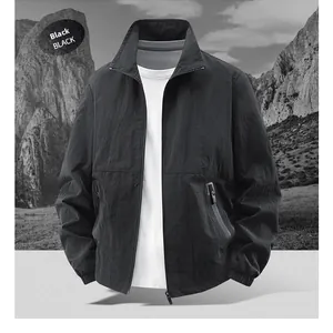 Detail view of black stand collar windbreaker jacket with zipper pockets and tech fabric