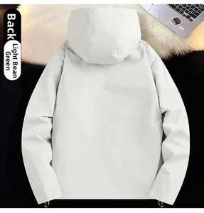 Rear view of a light bean green hooded outdoor jacket featuring adjustable drawstring hem