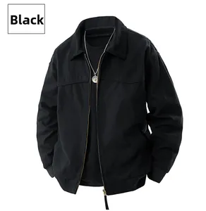 Detail of black cotton canvas work jacket with zip-up front, collar and rib-knit cuffs