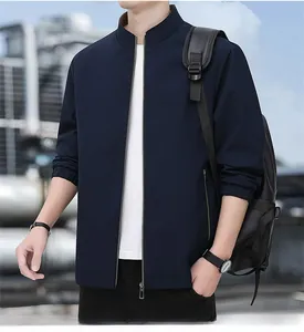 Detail of navy blue stand collar jacket with metal zipper and elastic cuffs