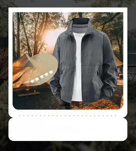 Macro shot of grey windproof outdoor jacket featuring a stand collar and elastic cuffs
