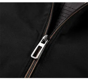 Macro shot of silver metal zipper and stylish red checkered lining on a black jacket