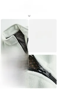 Detail of mint green fleece jacket showing stand-up collar and black metal zipper with liner