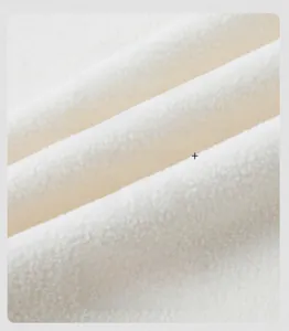 Detail of white thickened fleece lining with +7°C thermal lock for outdoor jacket