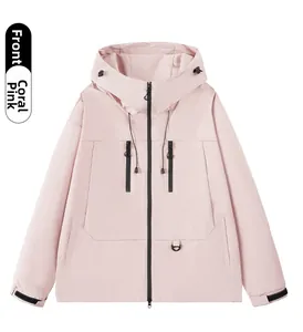 Detail of coral pink outdoor jacket with waterproof fabric and velcro cuffs