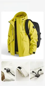 Detail of yellow outdoor jacket featuring adjustable drawstrings and velcro cuffs