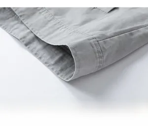 Detailed macro view of the parallel stitching and woven cotton fabric on the jacket hem