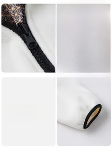 Detail of high-quality zipper and elastic cuffs on a white fleece mountain jacket