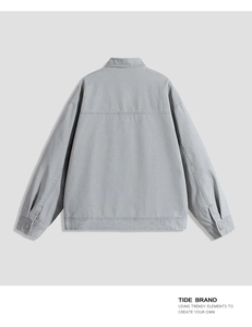 Detail view of the back of a gray cotton workwear jacket with dropped shoulder seams