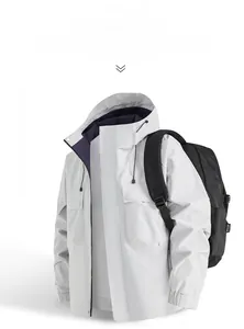 Front view of glacier grey outdoor hooded jacket with windproof placket and utility pockets