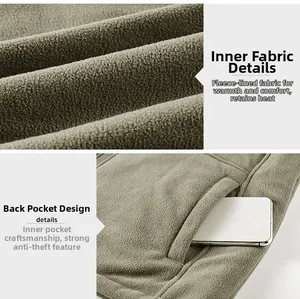 Detailed macro view of fleece lining and inner anti-theft pocket on a khaki vest