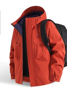 Men's outdoor hooded jacket in orange with blue lining and pockets for hiking and commuting