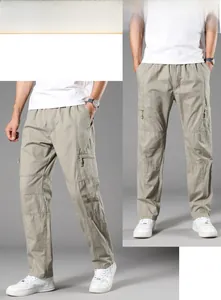 Detail view of khaki cotton cargo pants featuring large side pockets and straight cut