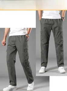 Detail view of cotton cargo pants featuring large side pockets and reinforced stitching