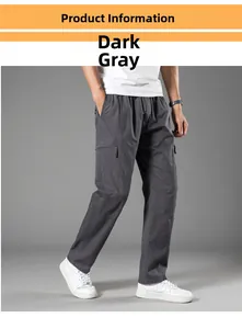 Detail view of men's loose dark grey cargo pants with side pockets in studio setting