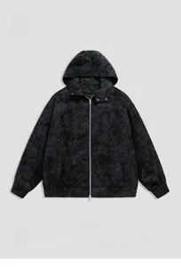 Macro detail of washed black PU leather jacket with vintage worn-in texture and hoodie design