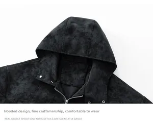 Detail of hooded PU leather jacket featuring metallic zipper and snap button collar