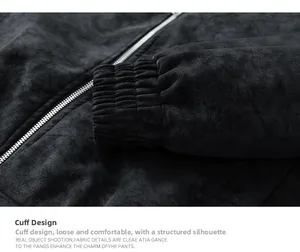 Close-up of elastic ribbed cuffs and metal zipper detail on a vintage washed PU jacket