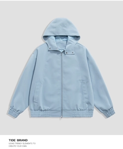 Detail view of the windproof fabric and elastic cuffs on this light blue hooded jacket