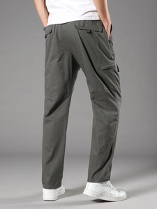 Men's relaxed fit cargo pants in dark grey cotton featuring multiple utility pockets