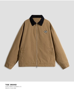 Detail of khaki work jacket featuring navy contrast collar and IVY letter patch