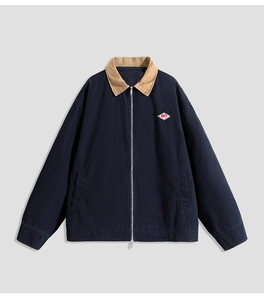 Detail of navy work jacket featuring a khaki corduroy collar and silver metal zipper