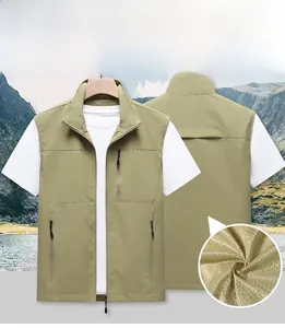 Detail view of khaki green outdoor vest showing breathable mesh lining and zipper pockets