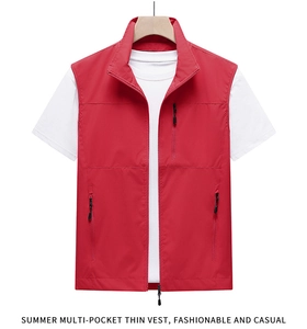 Detail view of the red outdoor fishing vest with multiple functional zipper pockets