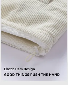 Close-up of corduroy hem with adjustable elastic drawstring and fleece lining detail