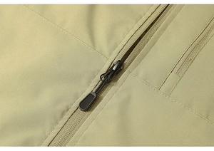 Close-up of functional outdoor vest featuring a heavy-duty zipper and durable tech fabric