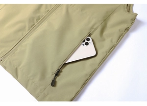 Detail view of khaki outdoor vest with a large side zipper pocket for smartphone storage