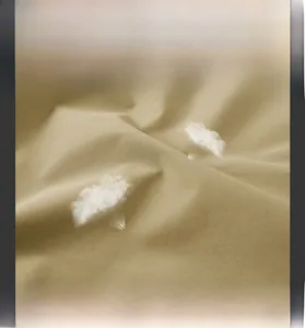 Close-up of earth-tone breathable fabric with soft brushed texture and water resistance