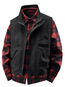 Outdoor men's fishing cargo vest in black over a classic red and black checkered shirt