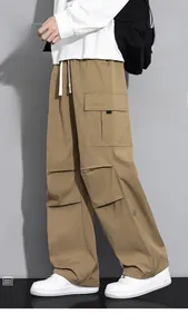 Detail of khaki cargo pants featuring large side pockets and an elastic drawstring waist