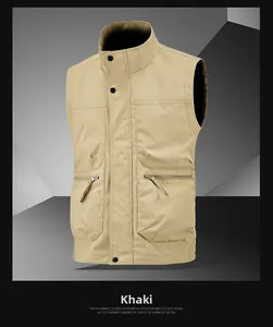 Detail of khaki cargo vest featuring standing collar and large zipper utility pockets