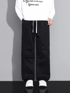 Men's black wide-leg cargo pants with white drawstring and knee pleated details