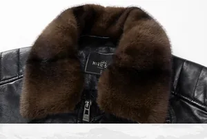 Detail of men's leather jacket featuring a plush brown fur collar and metallic zipper